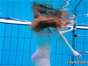 gorgeous female shows super-sexy assets underwater