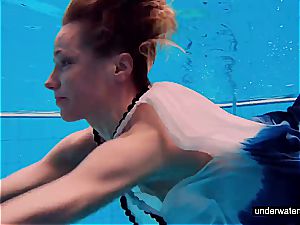 nubile doll Avenna is swimming in the pool